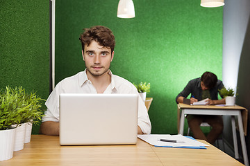 Image showing Young Businessman With Laptop In Lobby