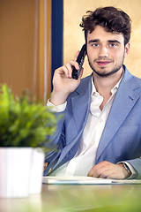 Image showing Receptionist Using Cordless Phone