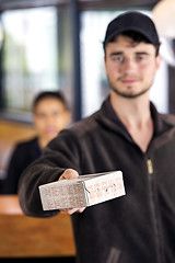 Image showing Delivery Man Giving Parcel In Office