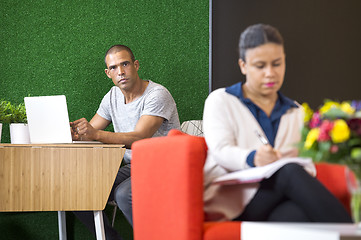 Image showing Confident Businessman Sitting In Lobby