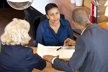 Image showing Businesspeople Talking To Receptionist