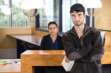 Image showing Delivery Man Standing At Office Reception