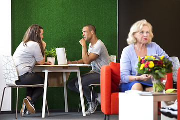 Image showing Businesspeople Discussing At Office Lobby