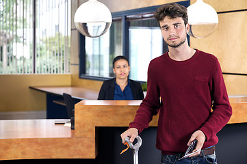 Image showing Man Standing At Hotel Reception