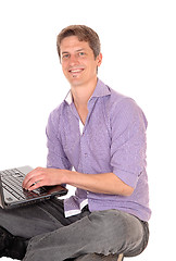 Image showing Man working on laptop.