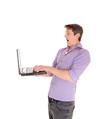 Image showing Man scared at his laptop.