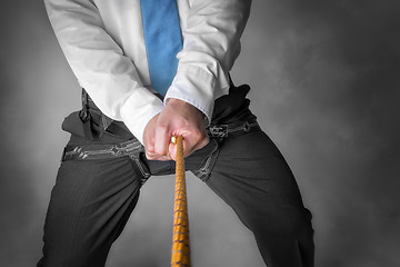 Image showing businessman on climbing rope