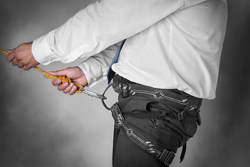 Image showing businessman on climbing rope