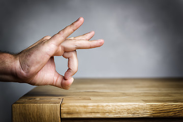 Image showing Man shoots with finger