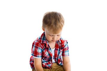 Image showing little boy in a plaid shirt over a white
