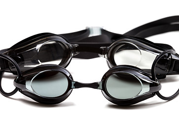 Image showing Two black goggles for swimming on white background