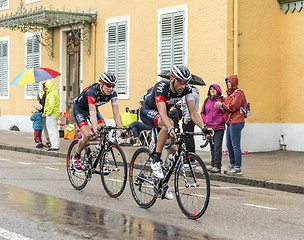 Image showing Two Cyclists Riding in the Rain - Tour de France 2014