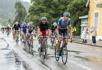 Image showing The Peloton Riding in the Rain - Tour de France 2014