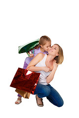 Image showing Happy a mother and daughter with shopping bags standing at studio 