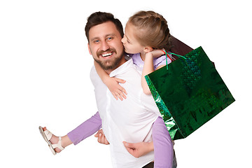 Image showing Happy father and daughter with shopping bags standing at studio 