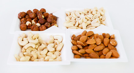 Image showing nuts mix in square paper plates