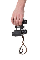 Image showing Vintage binocular in mans hand