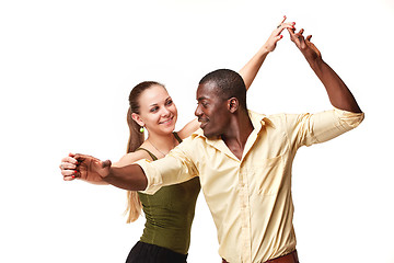 Image showing Young couple dances Caribbean Salsa, studio shot