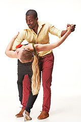 Image showing Young couple dances Caribbean Salsa, studio shot