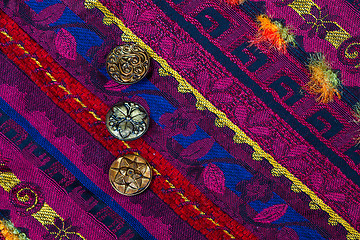 Image showing vintage tape with embroidered ornaments and old buttons