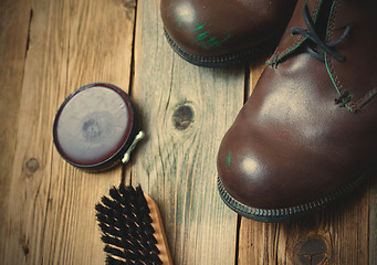 Image showing brown boots, shoe polish and shoe brush
