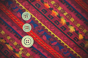 Image showing vintage tape with embroidered ornaments and old buttons