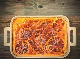 Image showing shred-pie in a white ceramic pot on vintage table