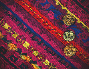 Image showing vintage tape with embroidered ornaments and old buttons