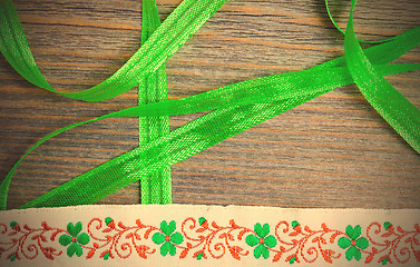 Image showing embroidered band and green tape