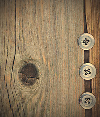 Image showing three metal vintage buttons