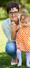 Image showing mother and baby in park making first steps