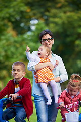 Image showing modern mother portrait  with kids in park