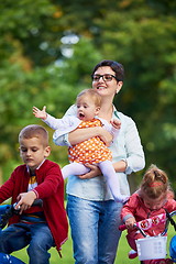 Image showing modern mother portrait  with kids in park