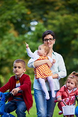 Image showing modern mother portrait  with kids in park