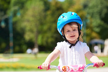 Image showing little girl with bicycle