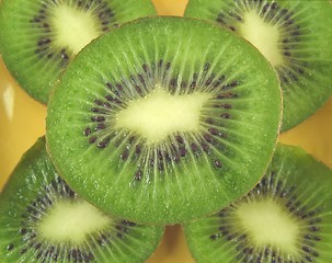 Image showing kiwis on a yellow plate