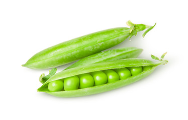 Image showing Three green peas in pods