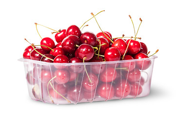 Image showing Red juicy sweet cherries in a plastic tray rotated