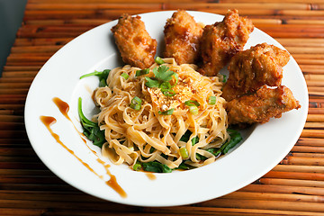 Image showing Chicken Wings with Noodles and Spinach