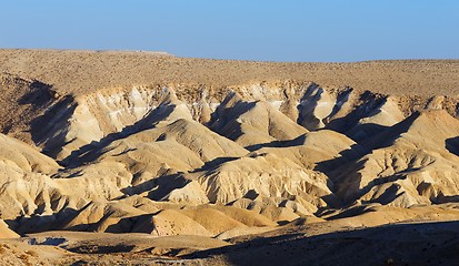 Image showing Textured yellow dunes in the desert at sunset 