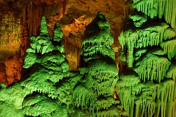 Image showing Strange green-lit stalagmite shapes in Soreq Cave, Israel