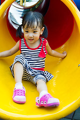 Image showing Asian kid sliding on Playground