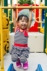 Image showing Asian Kid Hanging on bar 