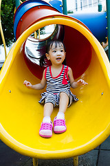 Image showing Asian kid sliding on Playground