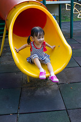 Image showing Asian kid sliding on Playground