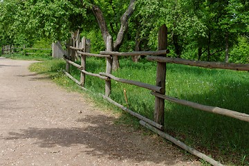 Image showing Rural path enclosed with lath fence at summer