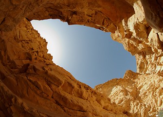 Image showing Blue sky seen from the bottom of a desert canyon
