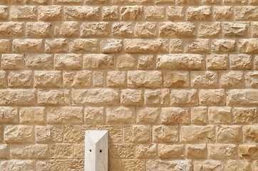 Image showing Texture of the wall built of rough yellow stone blocks 