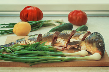 Image showing Fish and components for her preparation: vegetables, spices, oni