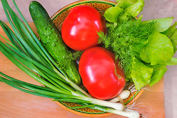 Image showing Fresh vegetables: tomatoes, cucumbers, onions, lettuce.